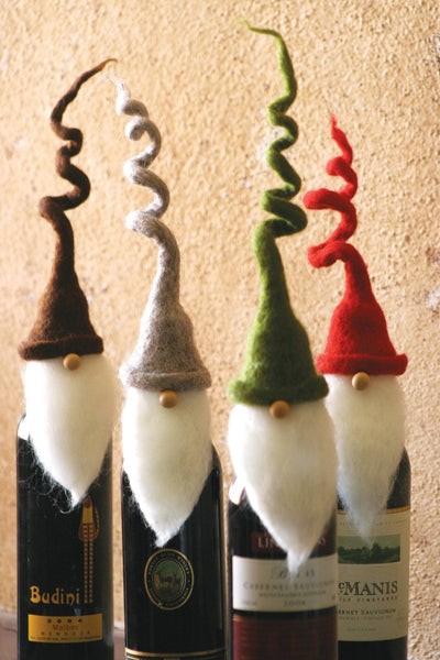 Set Of Four Felt Santa Wine Toppers With Curly Hats