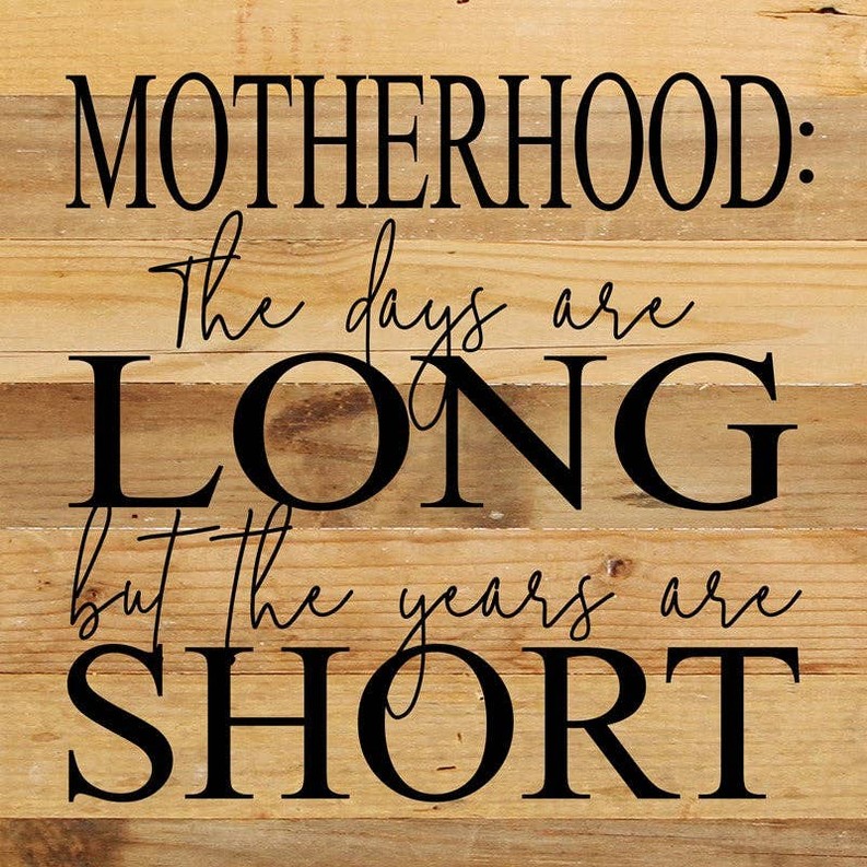 Motherhood: The days are long but t... Wall Sign